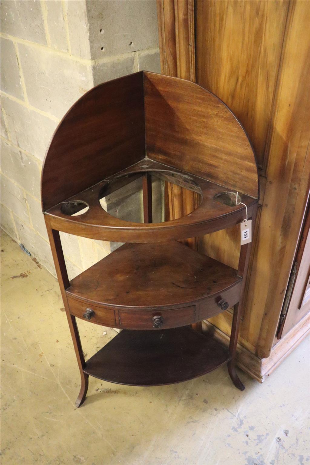 A George III mahogany corner washstand, width 58cm, depth 40cm, height 110cm